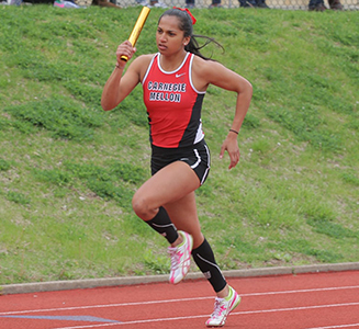 Debi Bhanja who is  a star student-athlete running on a track with a baton