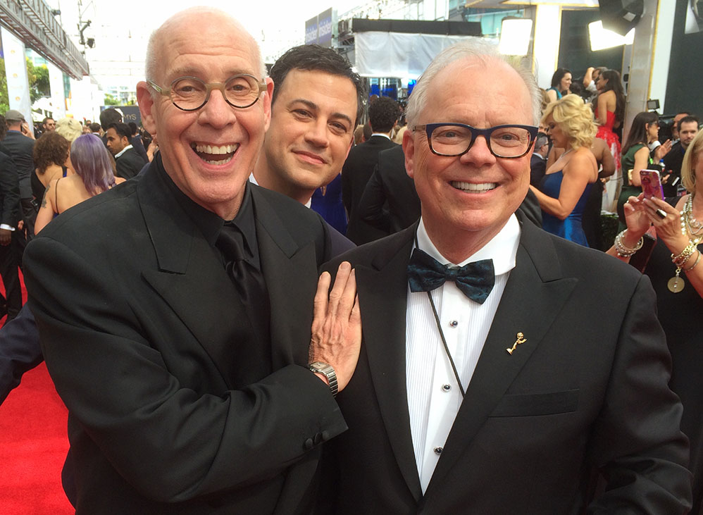 Joe and John on the red carpet, being photobombed by Jimmy Kimmel.