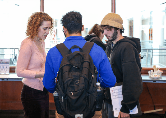 Students chat with Deputy Director for Academic Affairs Emily Half