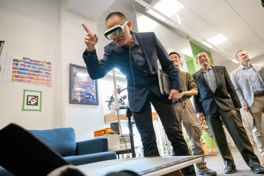 International military fellows test out augmented reality/virtual reality (AR/VR) technologies at the WiSE Lab (Wireless Sensing and Embedded Systems).
