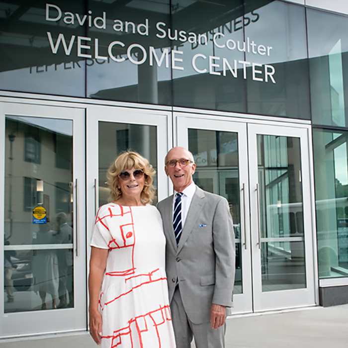 Susan and David Coulter Standing in Front of Welcome Center