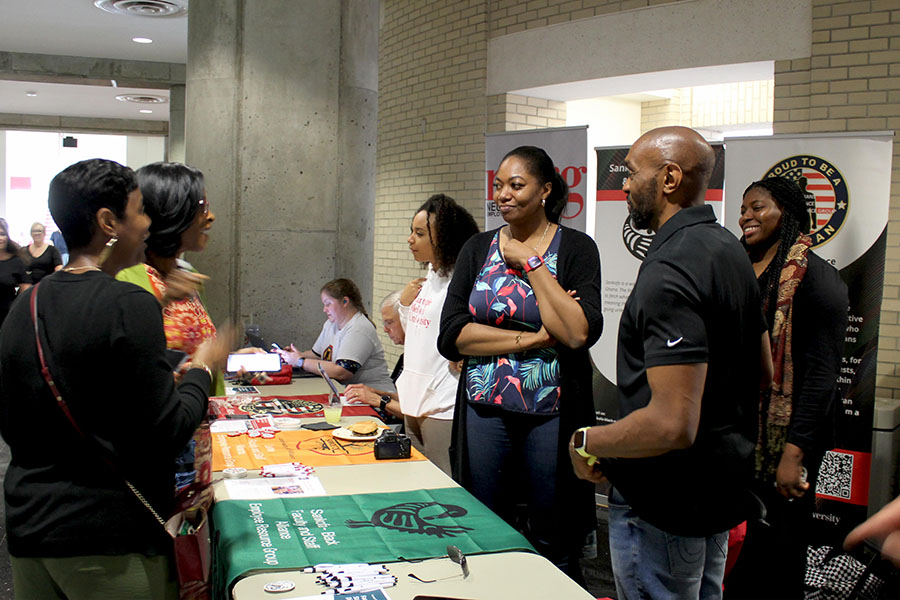 Sankofa co-leads at a table during the CMU Community Picnic