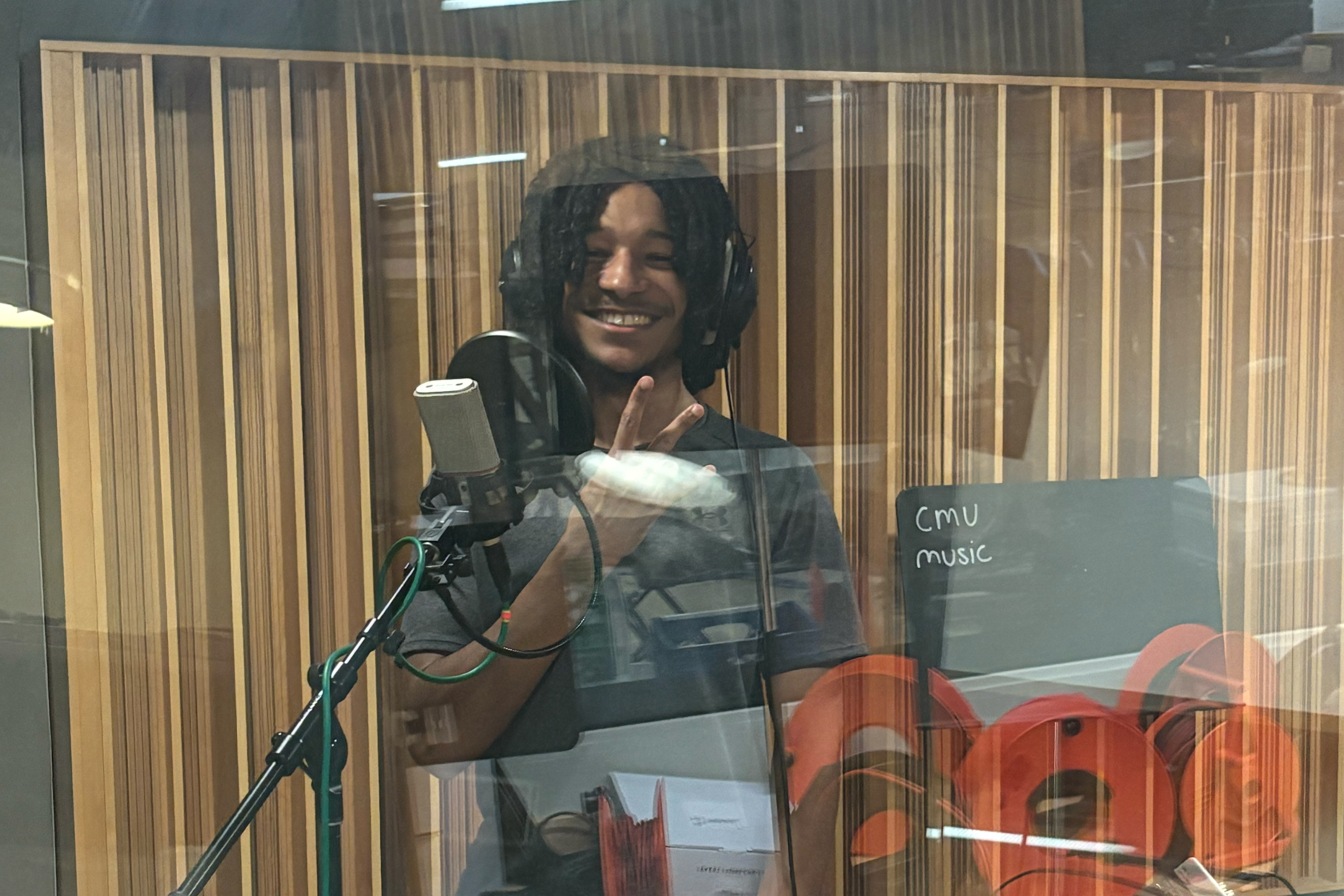 LEAP student, Adjoran, in a music recording studio