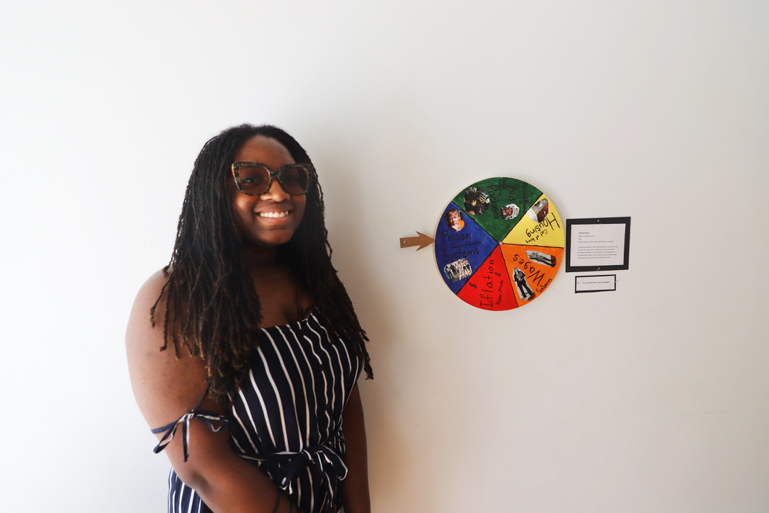 LEAP student, Cailah, standing next to a small painted wheel that she created