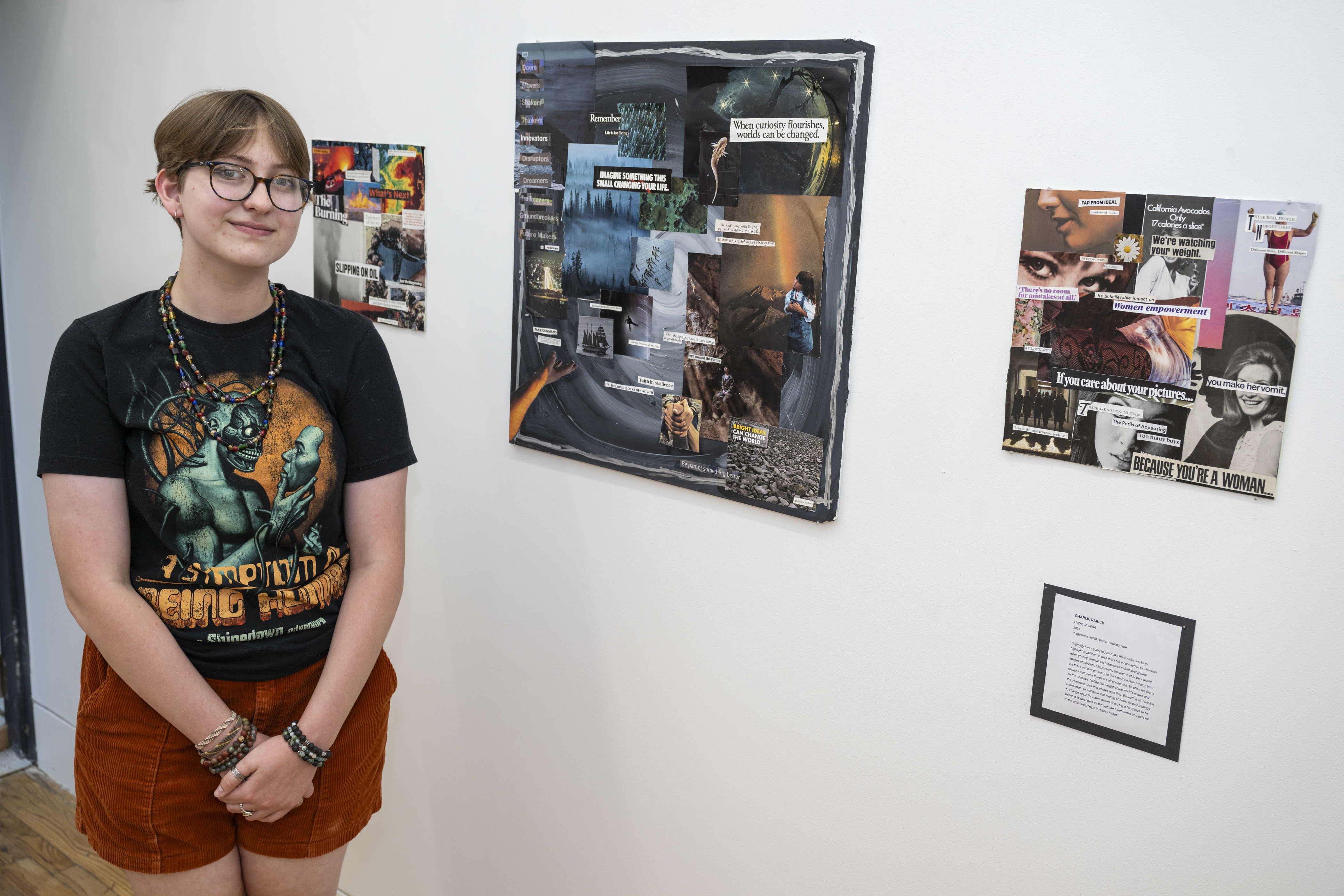 LEAP student, Charlie, standing next to a series of 3 collages he created
