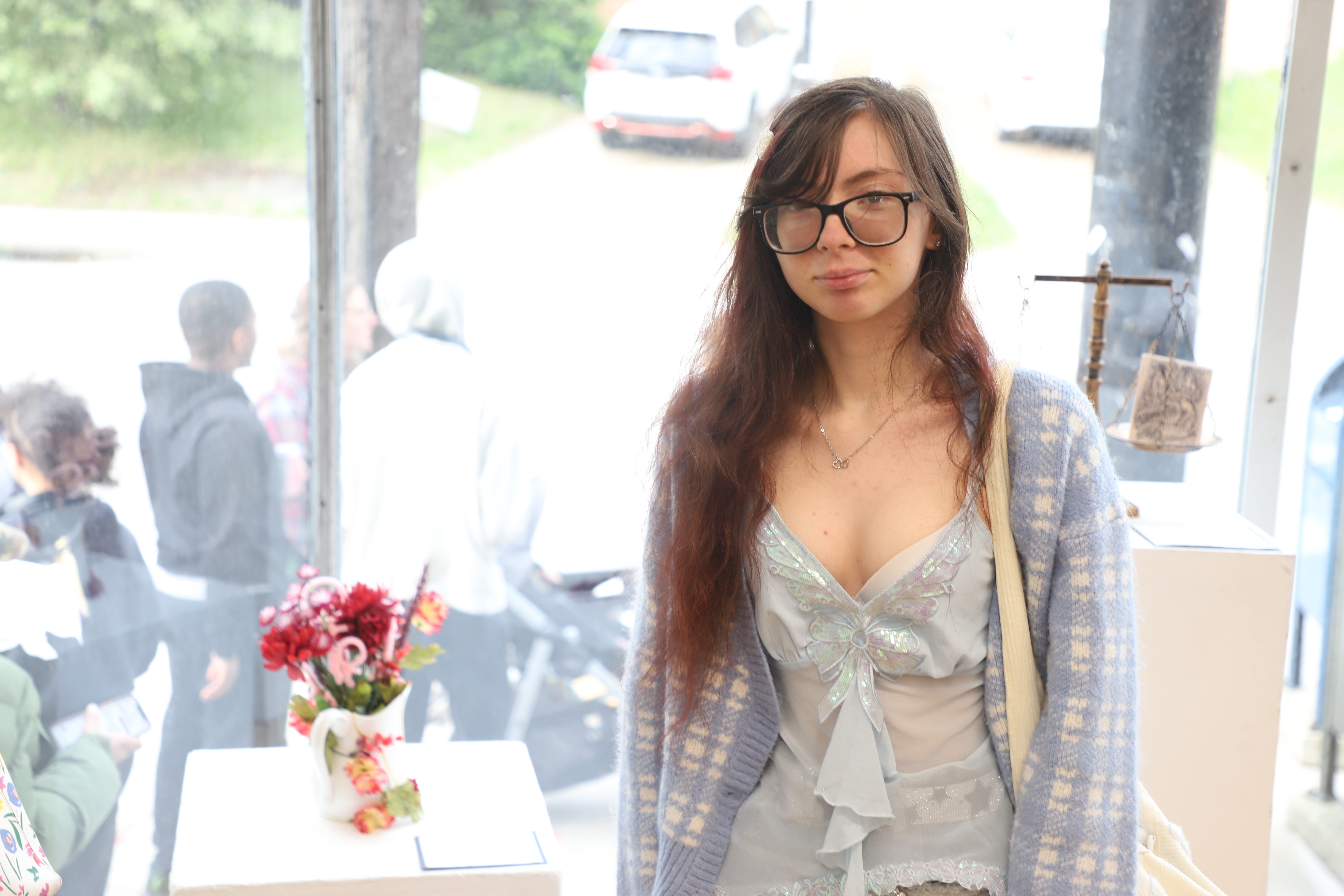 LEAP student Grace standing next to a sculpture she created