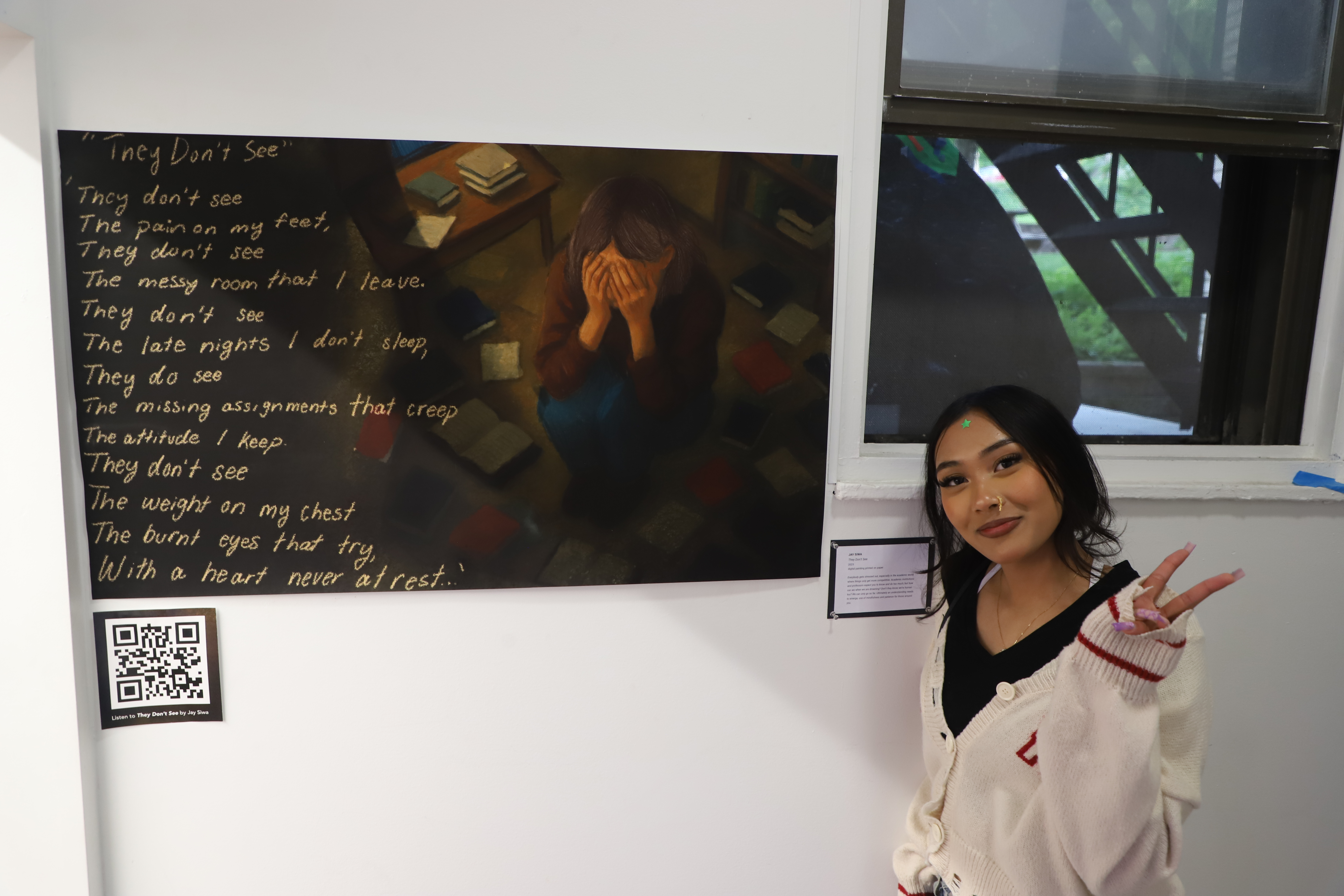 LEAP student Jay standing next to a digital painting she created