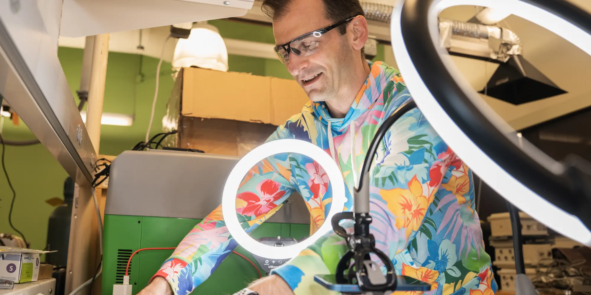 Man in lab wearing colorful shirt