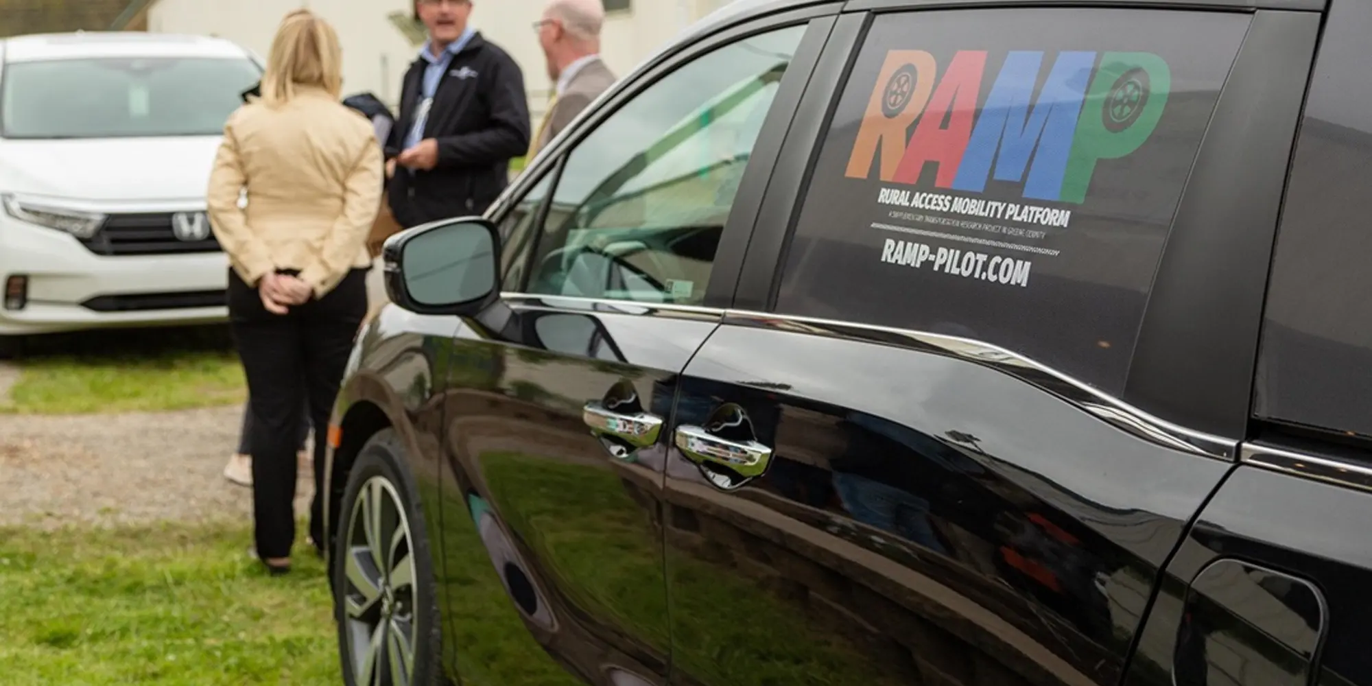Minivan with the "RAMP" logo