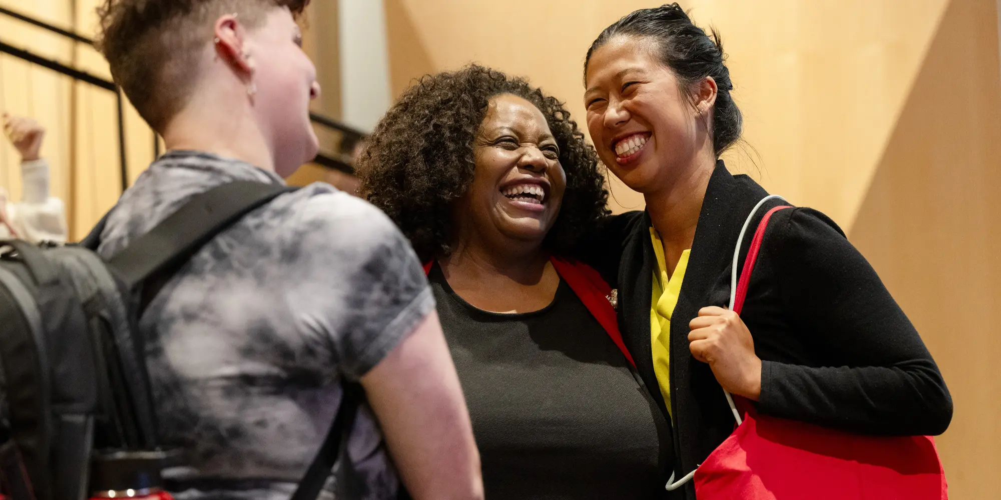 Attendees of the 2024 Pride Keynote Lecture, including M. Shernell Smith, Executive Director, Center for Student Diversity and Inclusion (center), chat during the event.