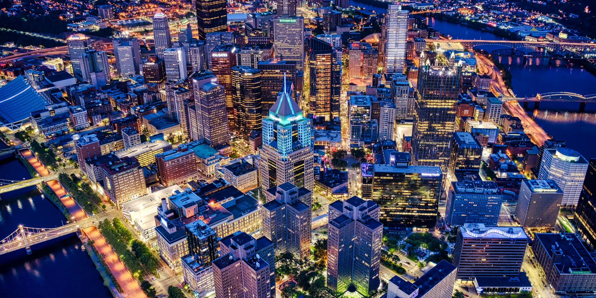 An aerial photo of Pittsburgh at night. 