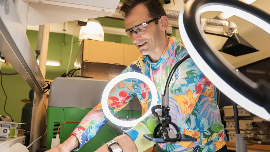 Man in lab wearing colorful shirt