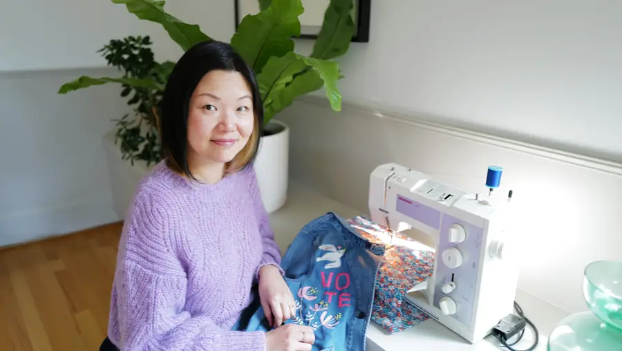 Ming Ming Chapman at sewing machine showing embroidery