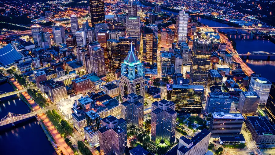An aerial photo of Pittsburgh at night.