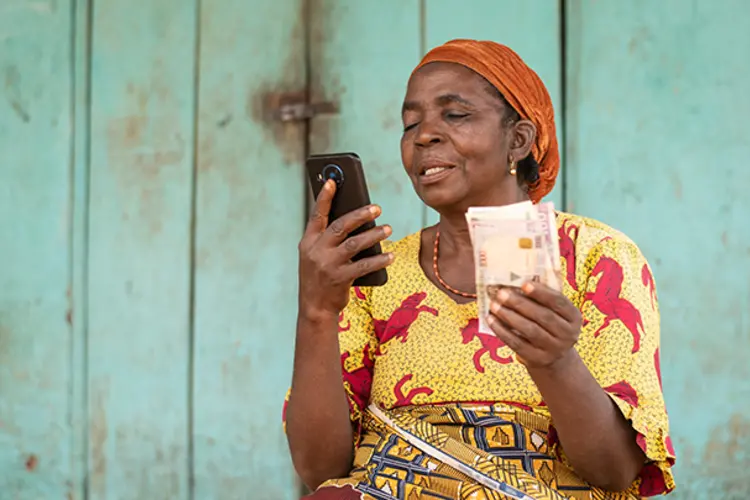 A woman looking at a cell phone.