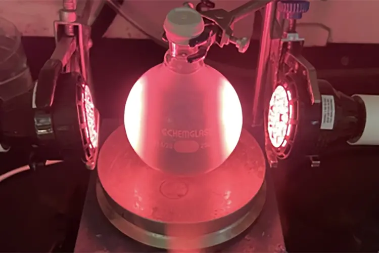 beaker shown under red light 