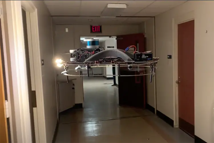 Robot flying in a hallway