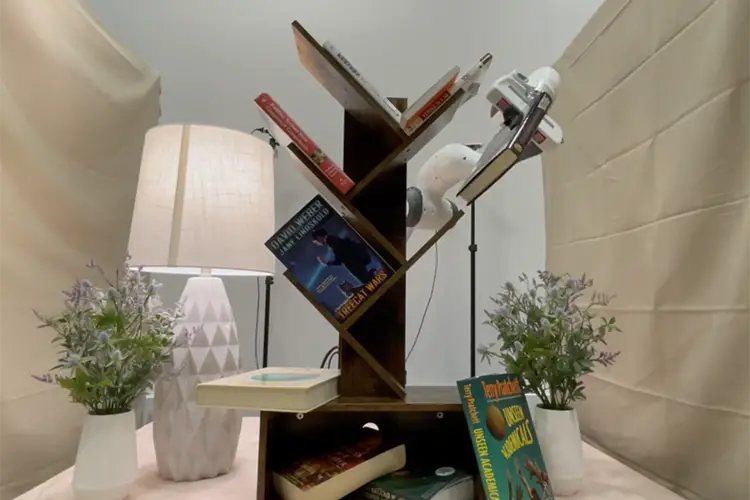 Books on a tilted shelf