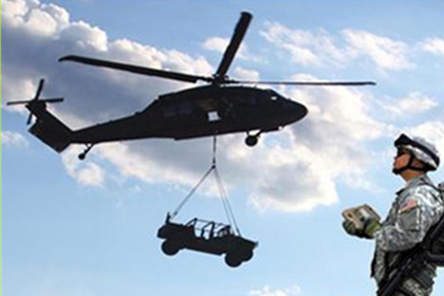 Image of an autonomous helicopter carrying a truck