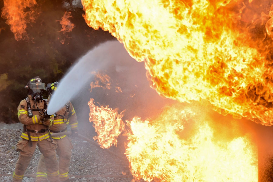 Image of a firefighter battling a blaze