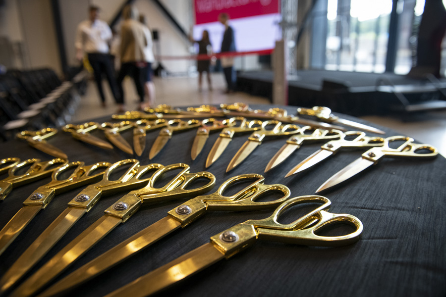 A photo of scissors for a ribbon cutting.