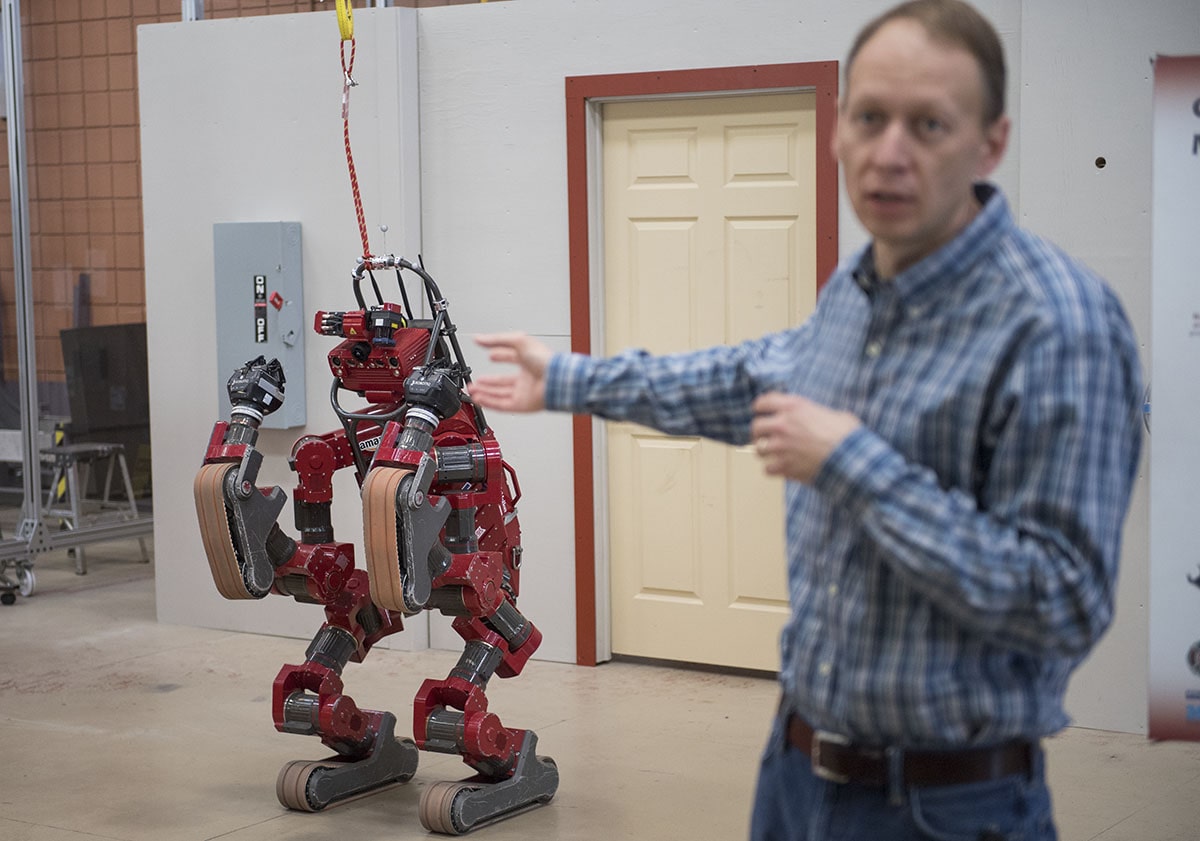 Principal Robotics Engineer Michael Vande Weghe delivers information about CHIMP, the CMU Highly Intelligent Mobile Platform robot, during a tour of the National Robotics Engineering Center in 2017.
