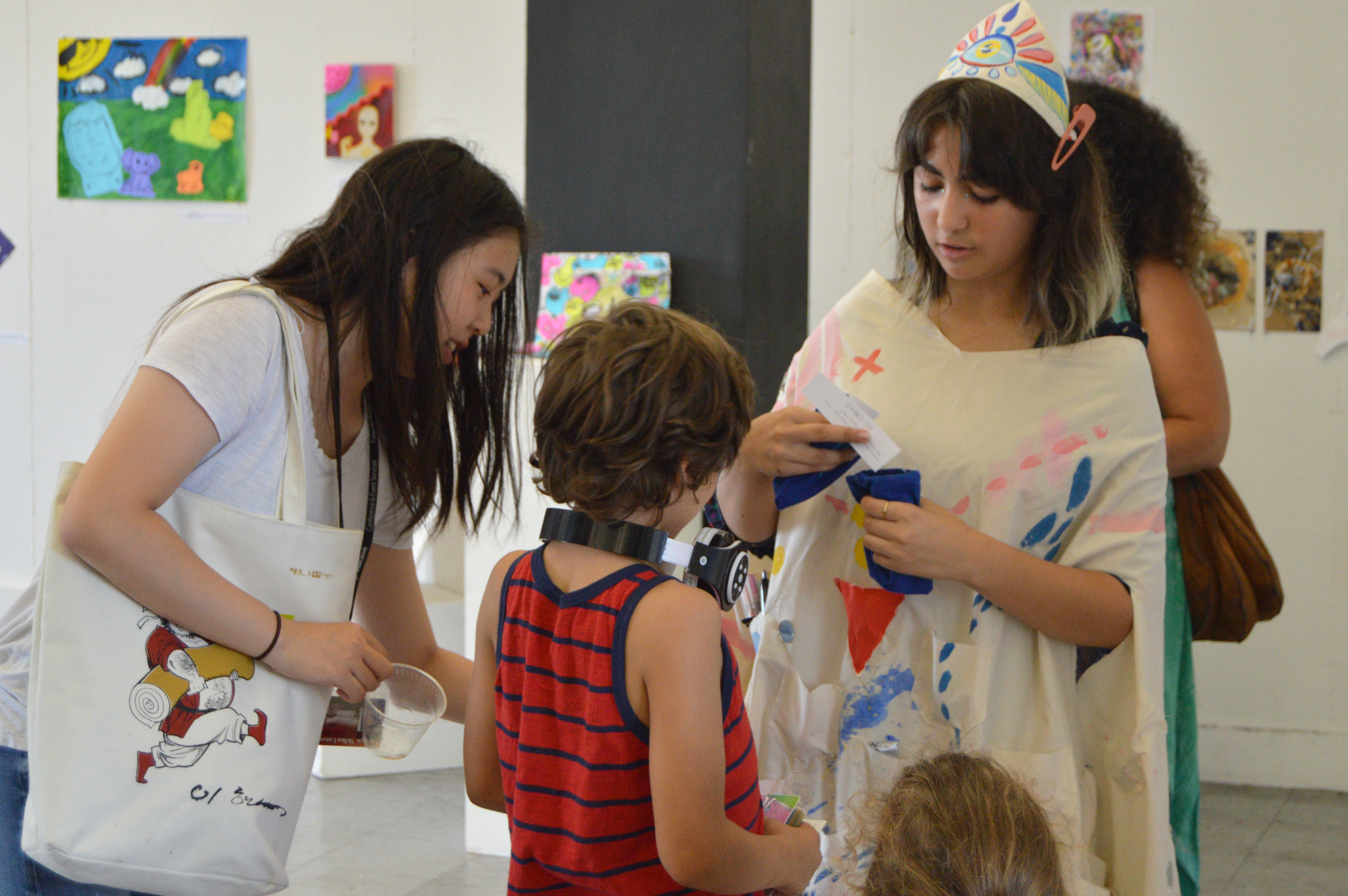 Image of three students working on the 2019 exhibition