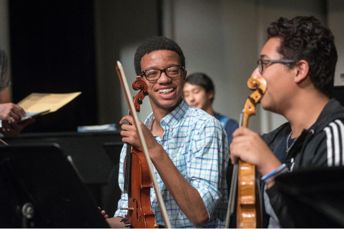 Pre-College Music students in orchestra.