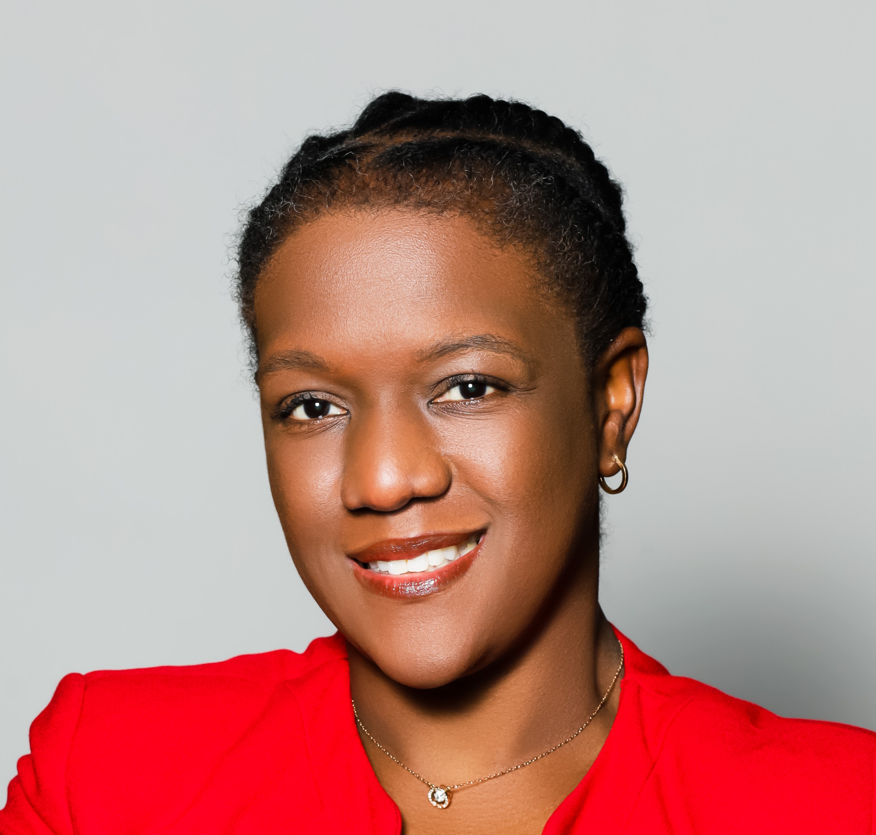 headshoot of angela reynolds in red top
