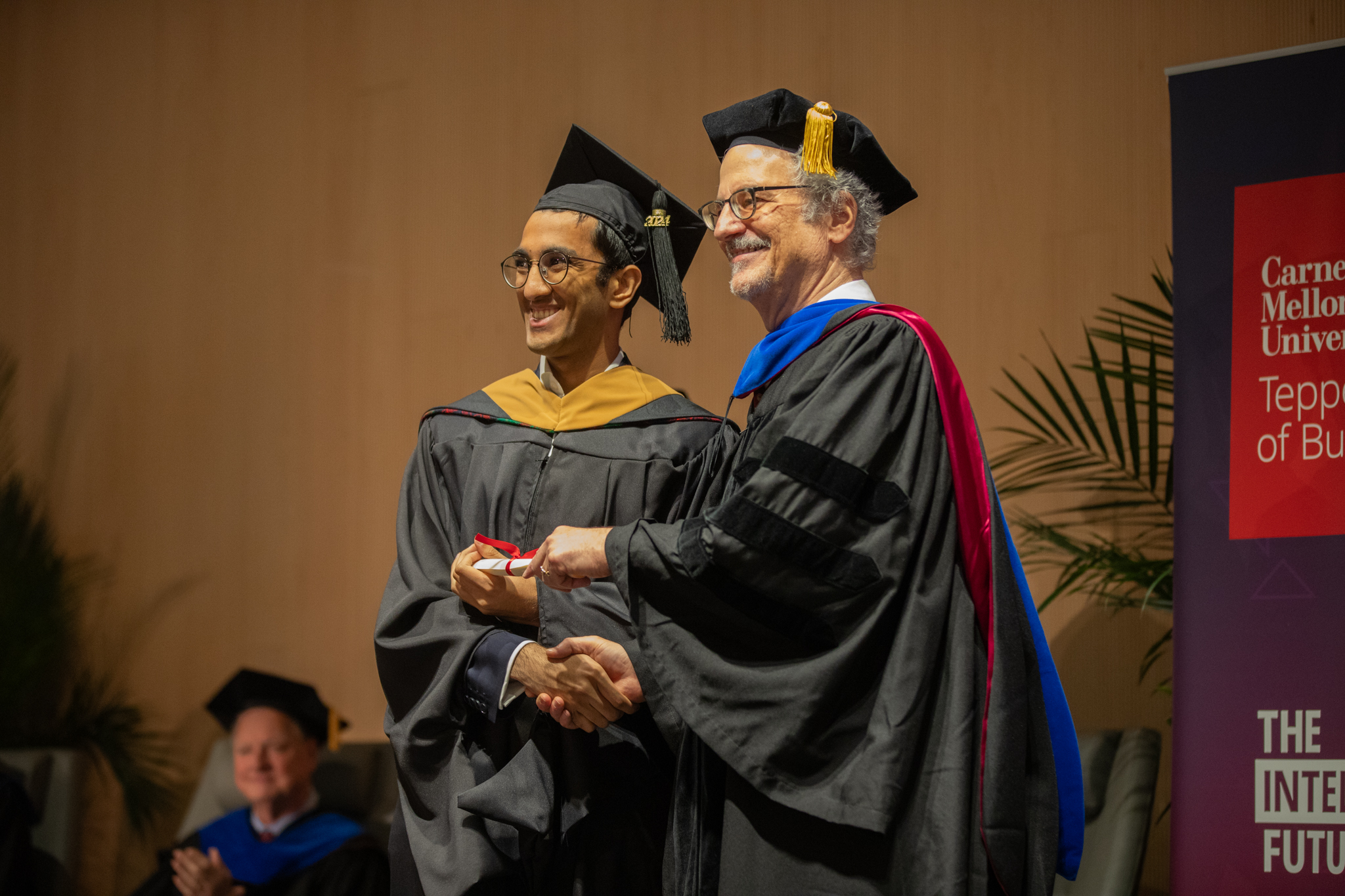 Dr. Seppi poses with student at commencement